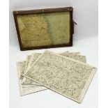 A collection of vintage motoring maps mounted on board contained within a leather case