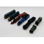 A collection of various unboxed OO gauge locomotives including a Tri-Ang "Davy Crockett" steam