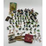 A collection of various plastic and lead figurines including cowboys, knights, horses etc