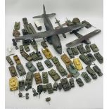A collection of pre-built military plastic kit vehicles including tanks, armoured vehicles, tanks