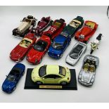 A collection of unboxed Burago and Maisto die-cast cars including Volkswagen New Beetle, Jaguar E