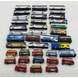 A collection of unboxed die-cast coaches and buses including several National Express coaches,