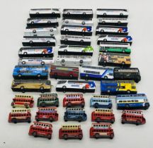 A collection of unboxed die-cast coaches and buses including several National Express coaches,