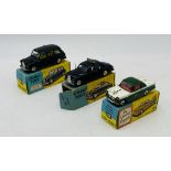 Three boxed Corgi Toys die-cast cars including an Austin Taxi (418), Triumph Herald Coupe (231 -