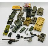 A small collection of unboxed plastic and die-cast military vehicles and weapons including tanks,