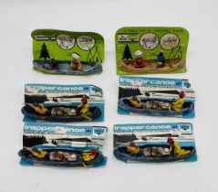 A collection of four carded Trapper Canoe sets (No 4502), along with two carded Herald Floating