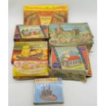 A collection of vintage boxed plastic construction kits including two Kleeware Littleware buildings,