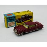 A boxed Corgi Toys die-cast Mercedes-Benz 220 SE Coupe in dark red/maroon (230)
