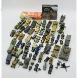 A collection of unboxed die-cast and plastic military vehicles including tanks, jeeps, armoured