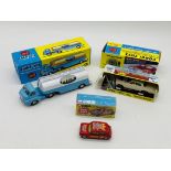 Three boxed reproduction Corgi Toys die-cast vehicles including Articulated Milk Tanker (1129),
