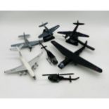 A small collection of die-cast and plastic military aircraft including planes and helicopters