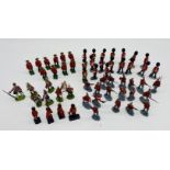 A collection of various plastic toy figurines including Royal Guards, Britains Canadian Mounted