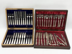 A canteen of silver handled cutlery (some A/F) along with another canteen of silver collared fish