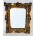 A large ornate gilt framed mirror - 123cm x 121cm120