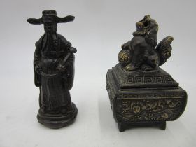 A brass Japanese incense burner surmounted by a Fo dog along with a resin figure of an Emperor