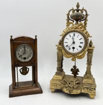 An antique French gilt clock with enamel dial marked "Hymarc Paris" to back of dial along with