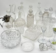 A collection of various cut glass including numerous decanters, vase, bowl, silver plated jug etc.