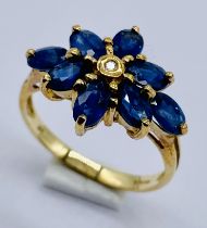 A sapphire and diamond cluster ring set in 9ct gold