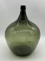 A large green glass carboy - height 49cm