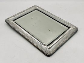 A hallmarked silver mirror (no stand), 27.5cm x 21cm