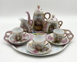 A continental gilt china tea set consisting of three cups, four saucers, milk jug, sugar bowl and