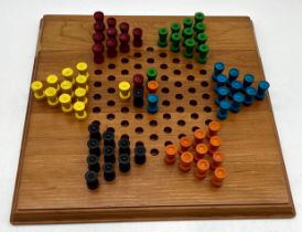 A Solitaire/Chinese Checkers wooden board game.