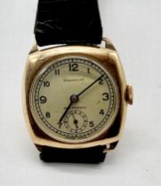 A 9ct gold Paramount wristwatch on leather strap
