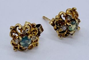 A pair of Alexandrite and diamond earrings set in 9ct gold