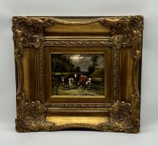 A vintage oil painting of cattle in an ornate gilt frame. Overall size 55cm x 50cm.