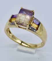 A 9ct gold dress ring set with citrines and amethysts
