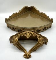 Two reproduction gilt corner shelves.