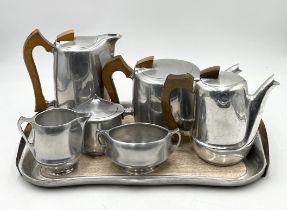A Picquot ware tea and coffee service comprising tea pot, coffee pot, hot water pot, sugar and