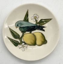 A Moorcroft pin dish in the finches and lemons pattern with impressed and painted marks