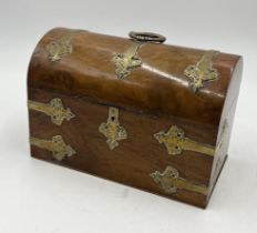 A Victorian walnut veneered brass bound dome topped box