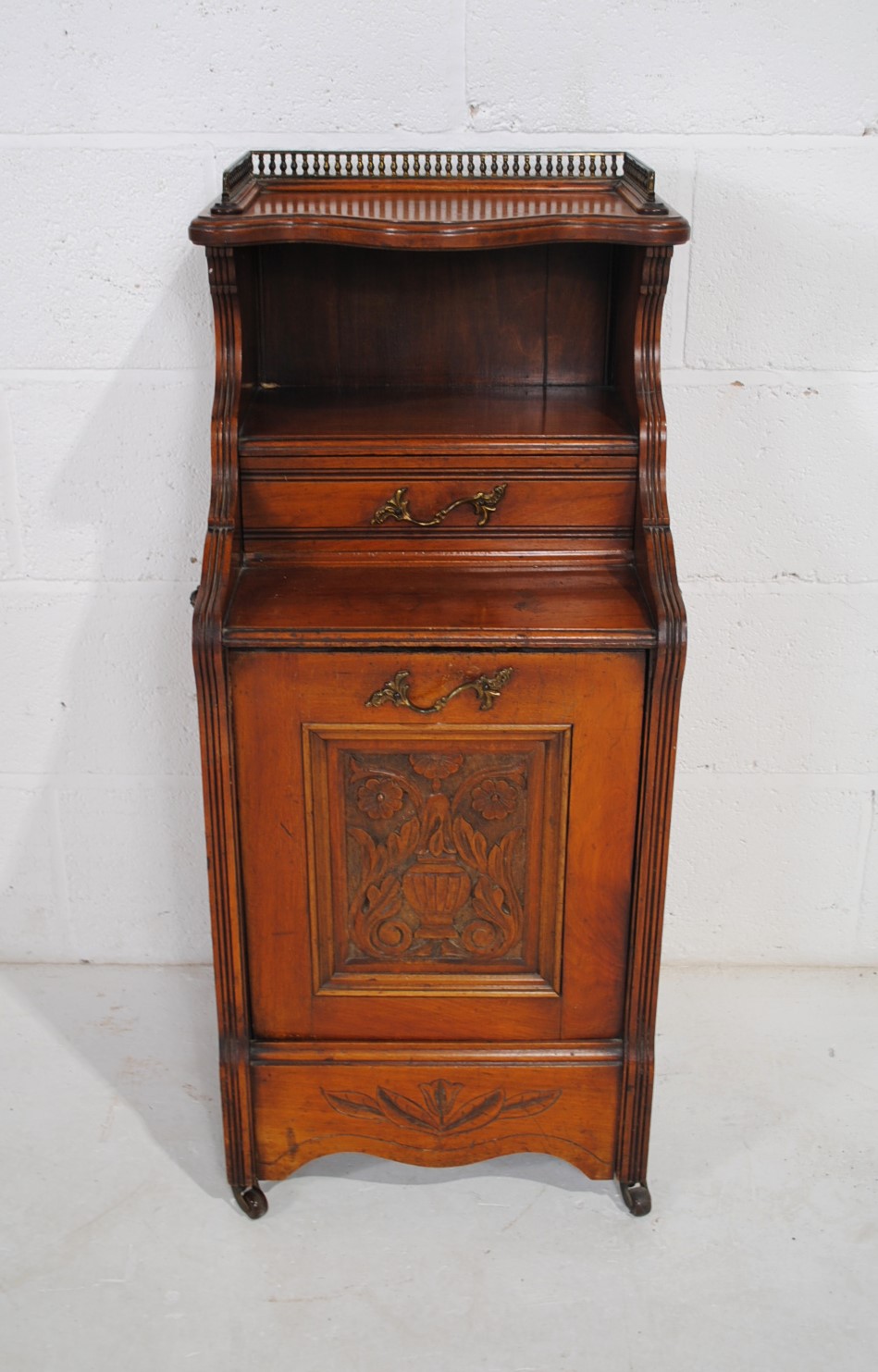 A turn of the century mahogany purdonium , with brass gallery to top