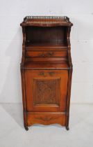 A turn of the century mahogany purdonium , with brass gallery to top