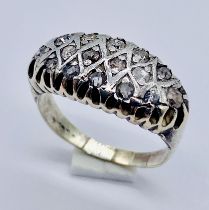A 9ct gold antique style ring set with diamonds, total weight 6.3g