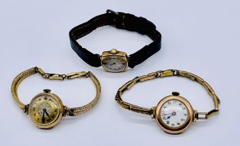 Two 9ct gold watches on rolled gold straps along with a 9ct watch on leather strap
