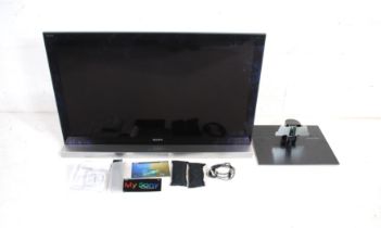 A Sony Bravia KDL-46HX903 46" LCD digital colour TV, with two stands, remotes, 3D glasses and