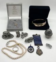 A small collection of silver jewellery, pewter animals, bracelet etc.