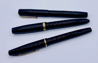 Three vintage pens, a Parker Duofold, Blackbird by Mabie Todd and a Burnham