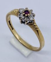 A 9ct gold ruby and diamond cluster ring
