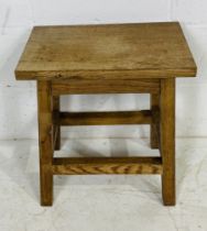 A small oak occasional table - height 51cm