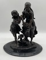 A large bronze figure group of two young girls collecting fruit on marble base, height 41cm