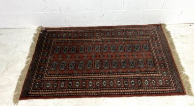 A pink ground rug. 96cm x 163cm