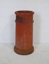 A vintage terracotta chimney pot, height 43cm