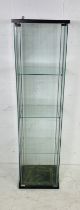 A freestanding glass display cabinet