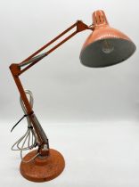 A vintage orange Anglepoise style lamp by Thousand & One Lamps Limited