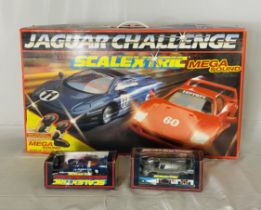 A boxed Scalextric Jaguar Challenge Mega Sound set, along with two boxed Scalextric racing cars (