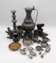 A quantity of antique and later pewter, including a large jug, candlestick, four spoons etc